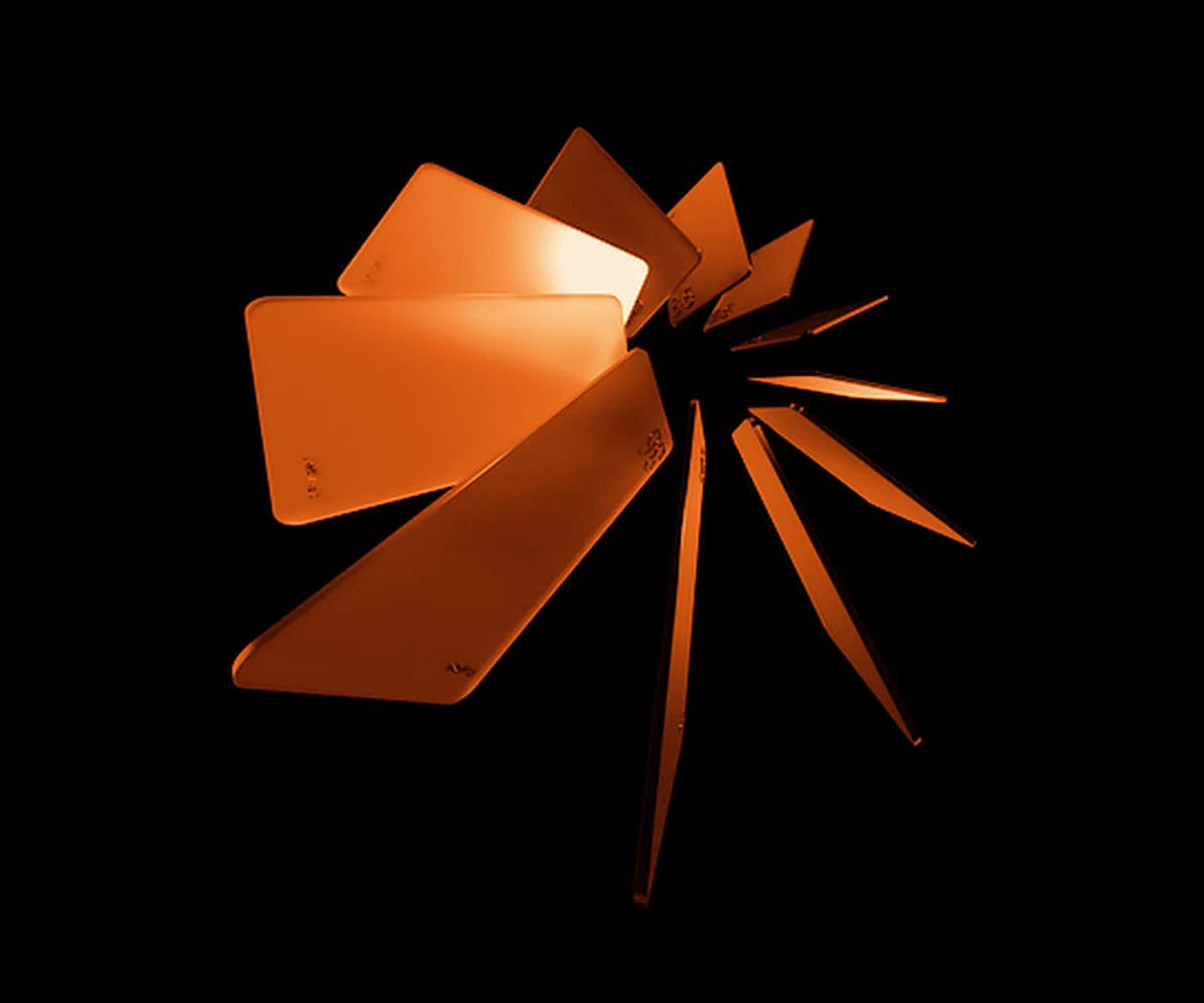A fan of glowing orange virtual cards spread out on black